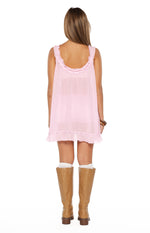 Rear view of the pink sheer frill mini dress showing the scoop back with frill trim and frilled hem