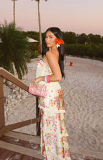 Side view of a yellow floral print maxi skirt with tiered ruffles