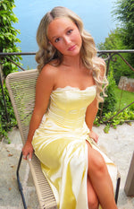 Yellow satin strapless maxi dress with white lace trim sweetheart neckline, boned bodice, ruched side, and high leg slit