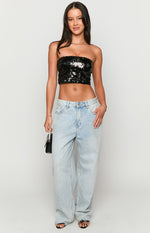 Front view of a black sequin strapless crop top with a straight neckline