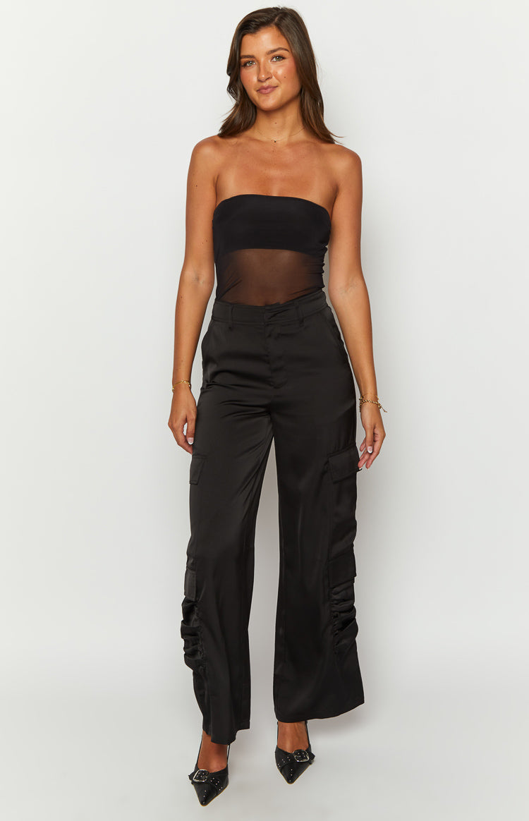 Front view of black satin wide-leg cargo pants with side cargo pockets and ruched lower leg detail