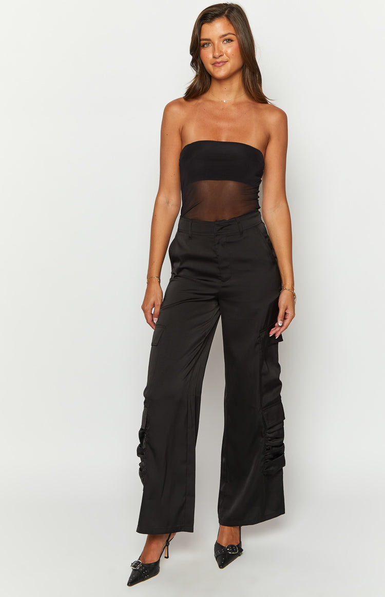 Front view of black satin wide-leg cargo pants with ruched detail on the lower leg pockets