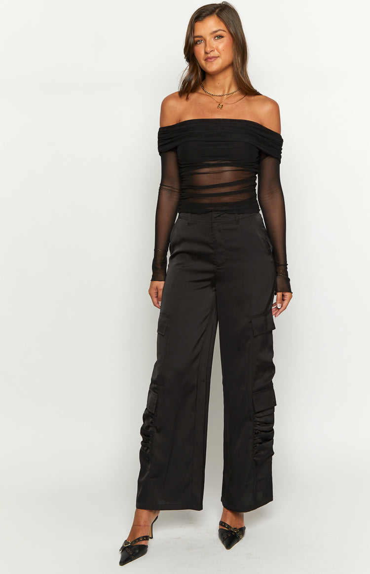 Black satin wide-leg cargo pants with ruched detailing on the lower outer seams