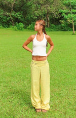 Beginning Boutique Alamara Yellow Floral Detail Wide Leg Pants yellow wide leg pants with floral cutouts on the waistband