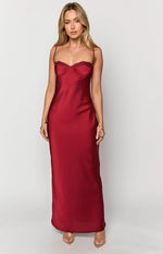 Front view of a scarlette red satin maxi dress with a sweetheart bustier neckline, lace trim, and thin spaghetti straps