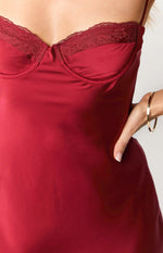Close-up of the red satin maxi dress showing the underwire bust with lace trim