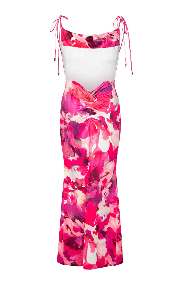 Rear view of a pink print maxi dress with tie-up spaghetti straps, a white upper back panel, low scoop back, and ruched waist