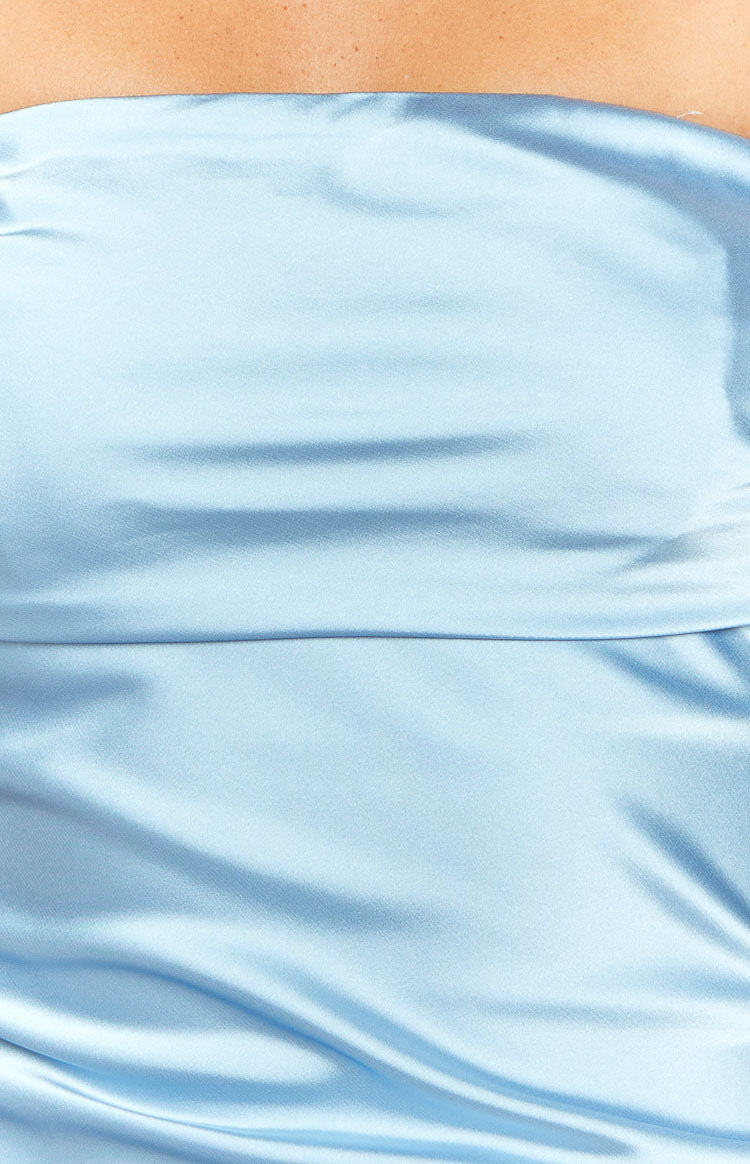 Close-up of the light blue satin fabric of the mini dress, highlighting the horizontal gathered detail