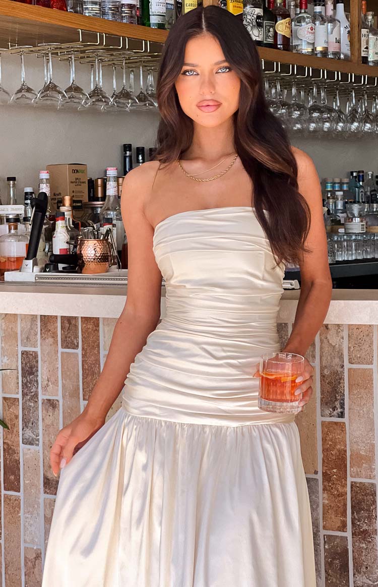 Cream satin strapless maxi dress with a ruched bodice and a flowing A-line skirt