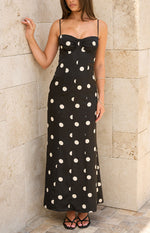 Black satin polka dot maxi dress with sweetheart neckline, ruched bust, spaghetti straps, and lace trim