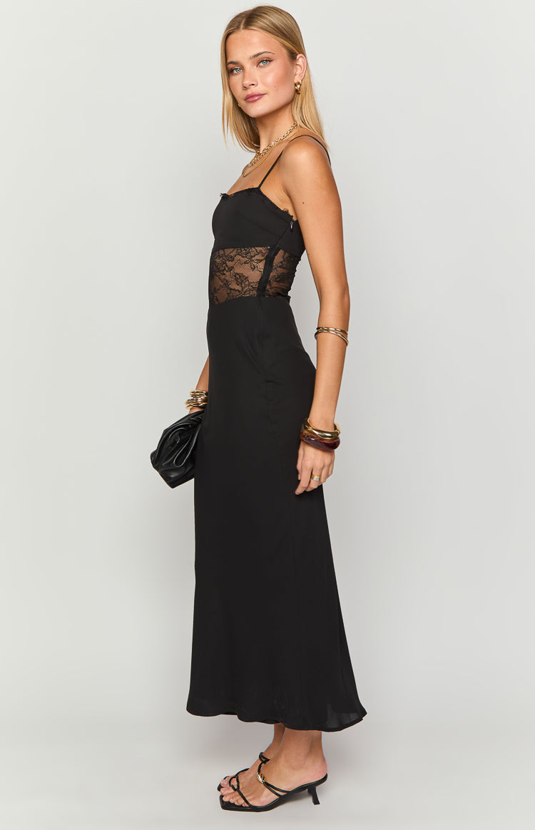 Side view of a black maxi dress with sheer lace side panels on the bodice, thin spaghetti straps, and a straight neckline