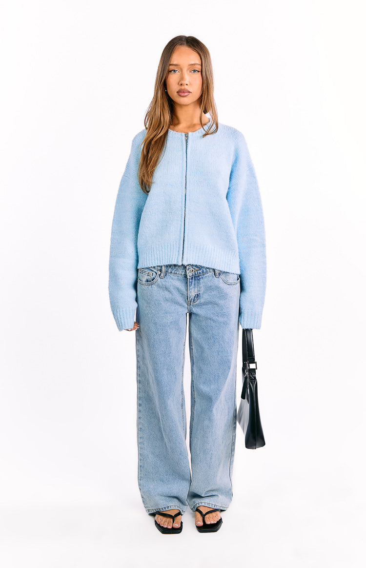 Front view of a light blue fuzzy knit cardigan featuring a full zip front, long sleeves, and a relaxed fit