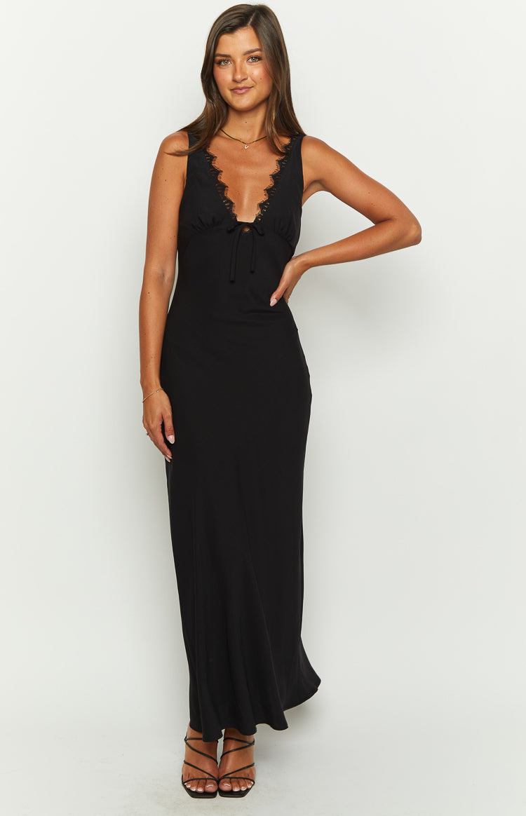 Black sleeveless V-neck maxi dress with lace trim and a front tie detail, flowing to the floor