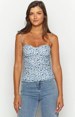 Blue floral top with sweetheart neckline, tie-up spaghetti straps, and shirred bodice