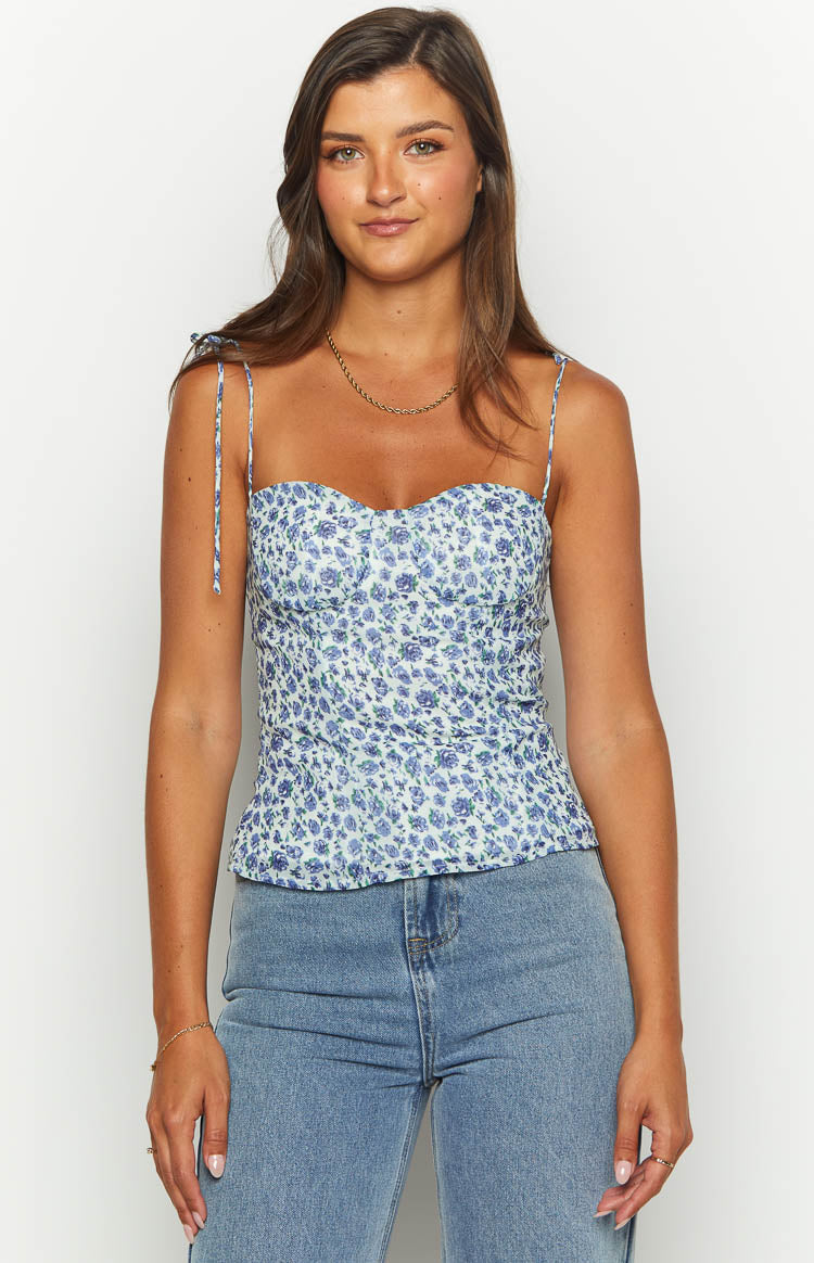 Blue floral top with sweetheart neckline, tie-up spaghetti straps, and shirred bodice