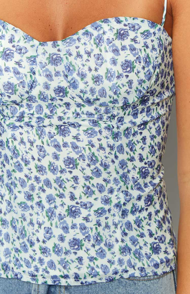 Close-up of the blue floral top with a sweetheart neckline and bust seam detail
