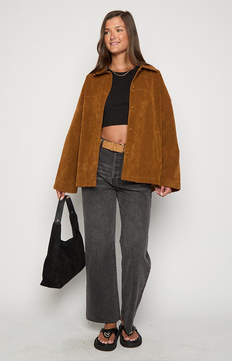 Full length view of a tan suede oversized jacket with a collared neckline and button-front closure