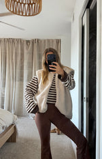 Beginning Boutique Summi Cream Teddy Fleece Vest cream teddy fleece vest with a relaxed fit and sleeveless design