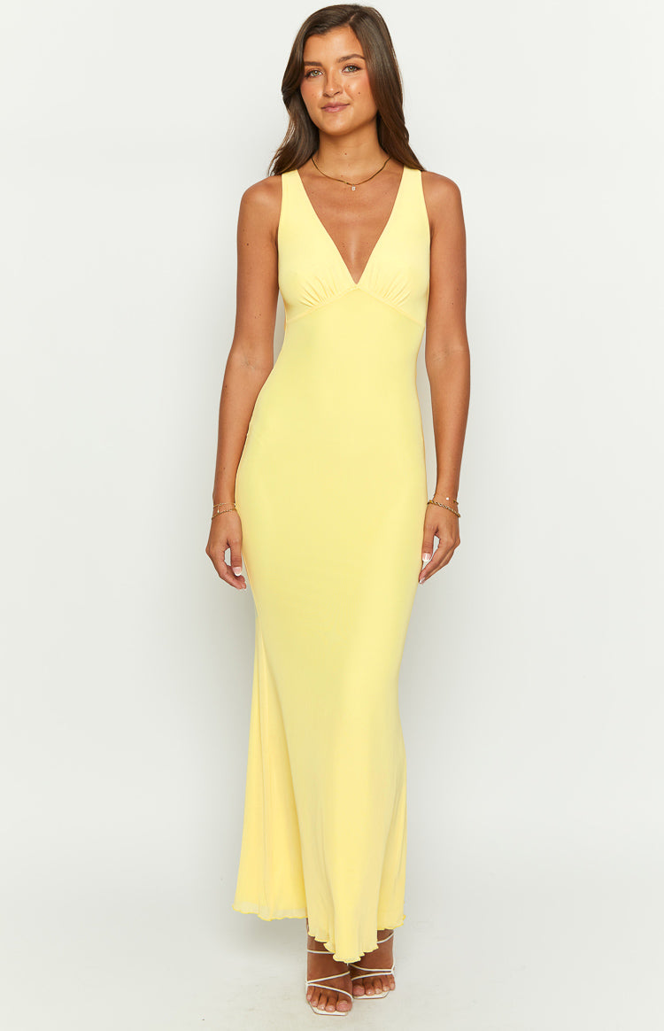 Front view of a sunflower yellow mesh maxi dress with a deep V-neck and ruched bust detail