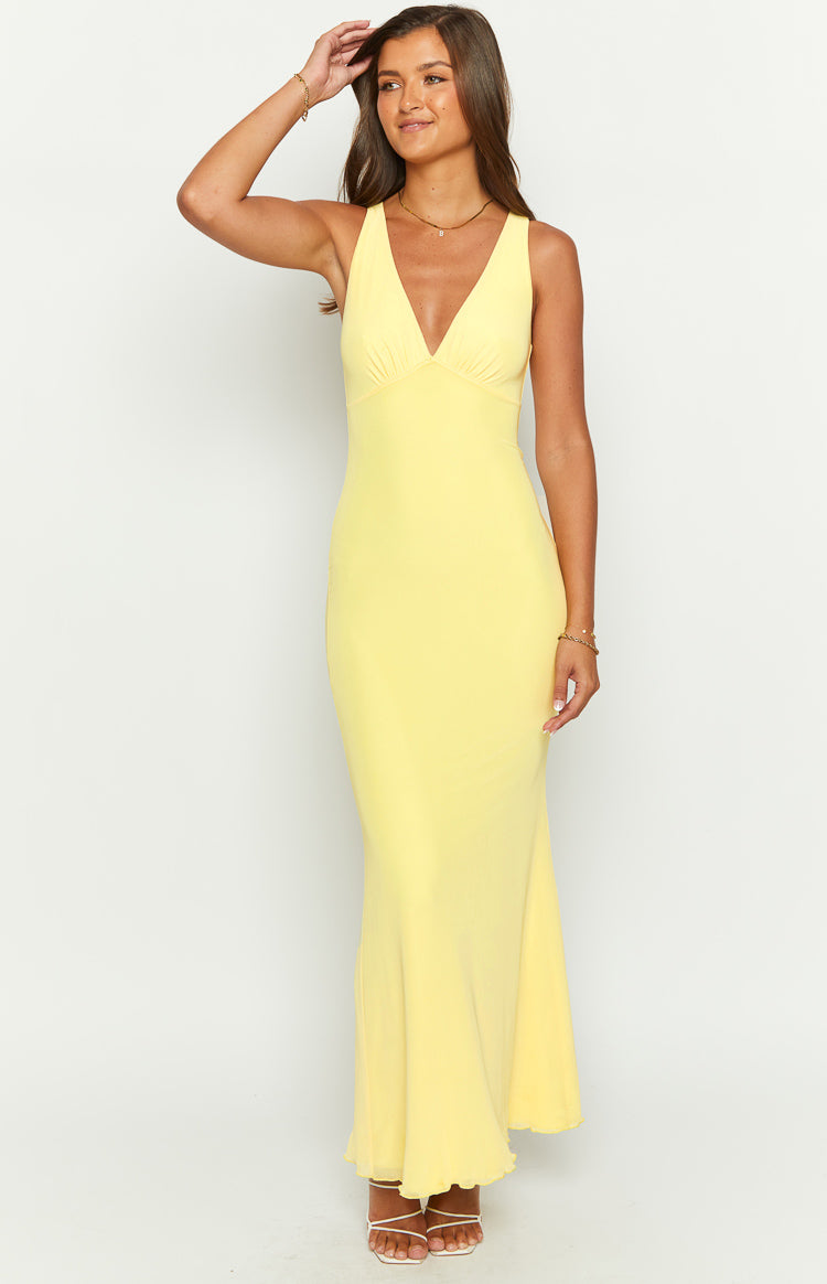 Front view of a sunflower yellow mesh maxi dress with a deep V-neckline and ruched bust, fitted silhouette