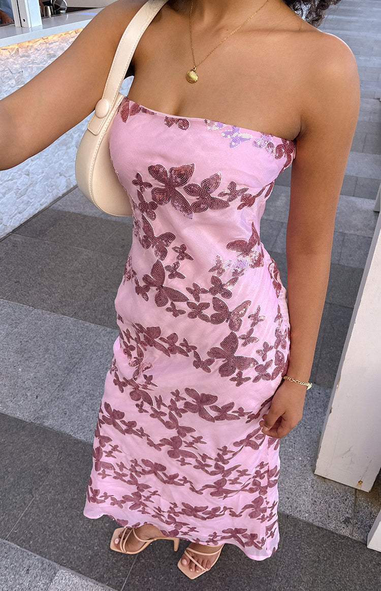 Pink strapless maxi dress with a fitted bodice and all-over butterfly sequin pattern to the hem