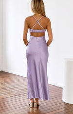Rear view of a lilac satin maxi dress with criss-cross spaghetti straps, shirred back band, and large back cutout