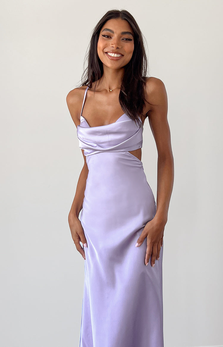 Front view of a lilac satin maxi dress with a cowl neck and side cutouts