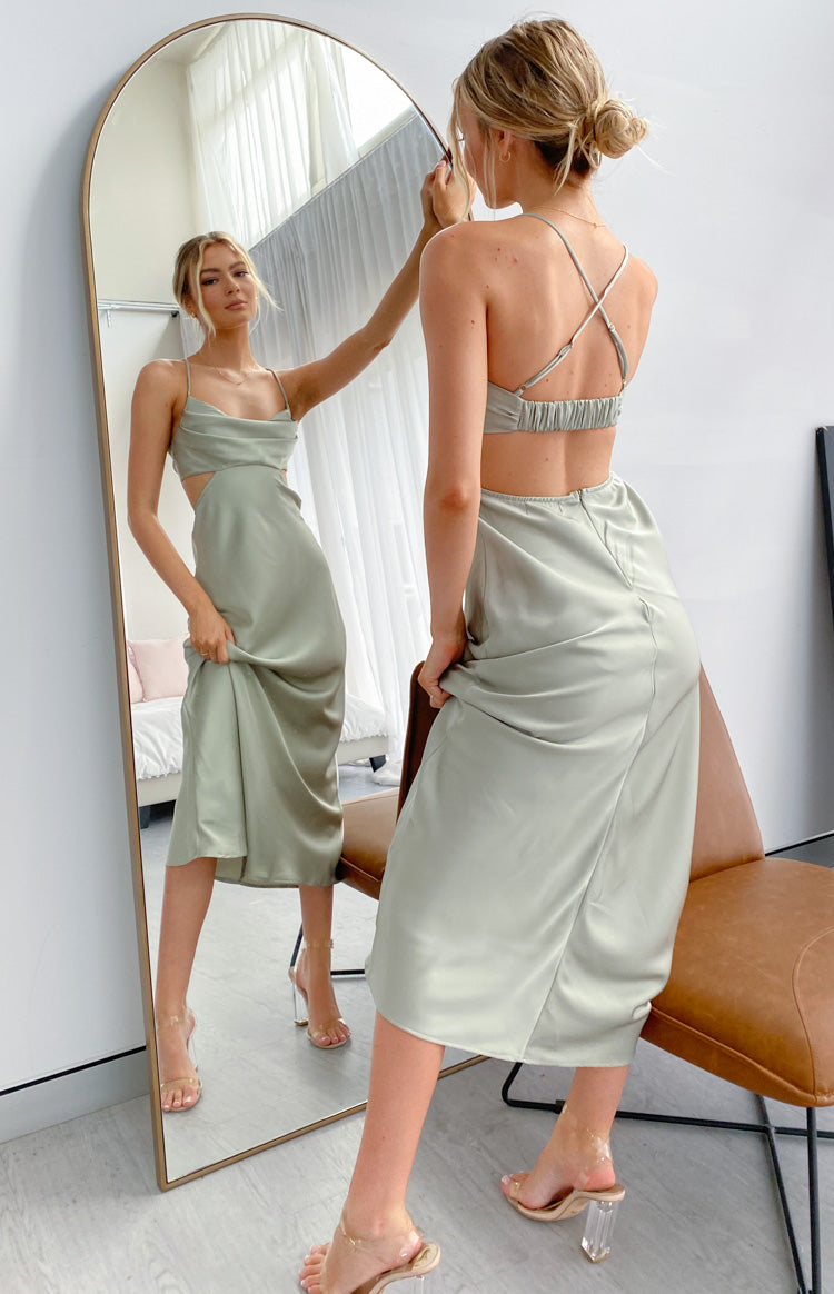 Sage silky maxi dress with cowl neck, side cutouts, open back with criss-cross straps, and side slit