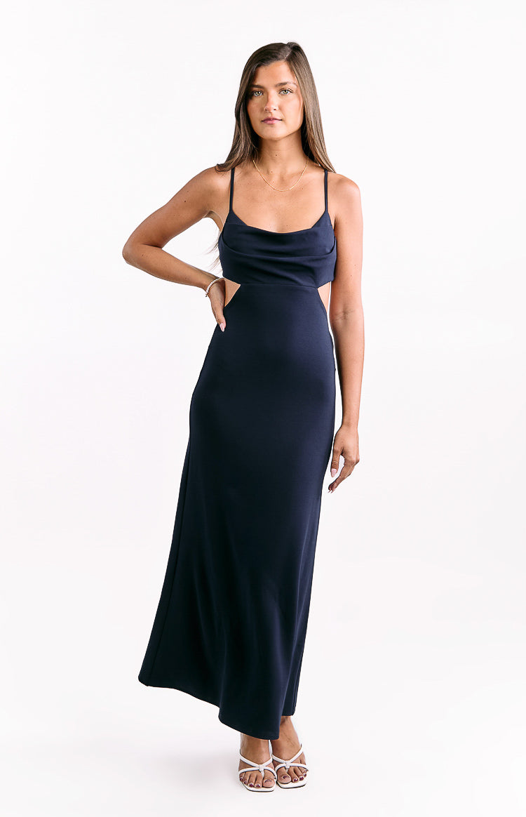 Navy crepe formal maxi dress with a draped cowl neck, thin spaghetti straps, and side waist cutouts