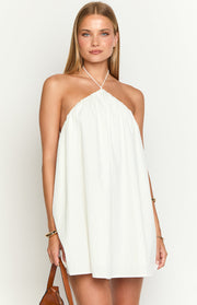 White halter mini dress with a gathered neckline and a loose, voluminous fit