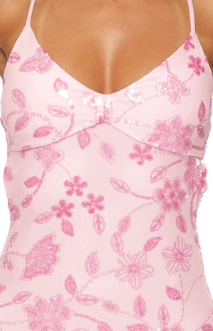 Detail shot of the pink sequin floral pattern on the mesh V-neck bodice with thin spaghetti straps