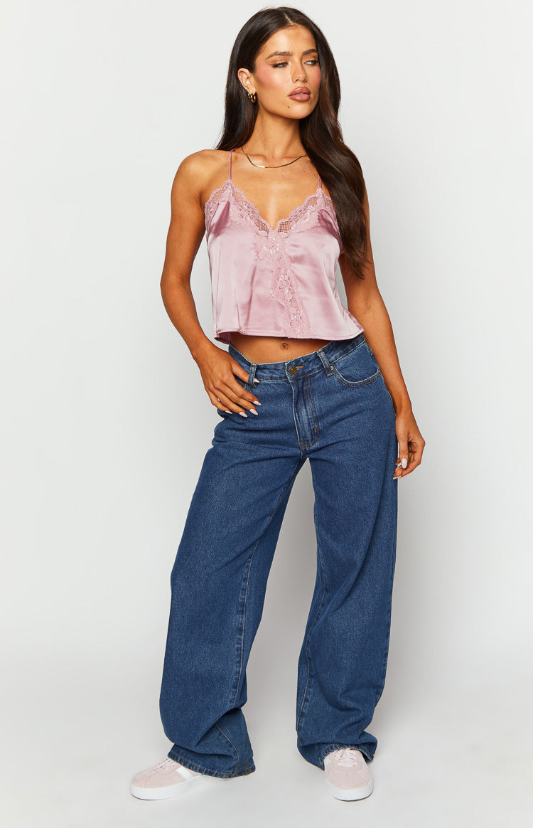 Pink satin cami top with V-neckline and delicate lace trim detail on the bust and front