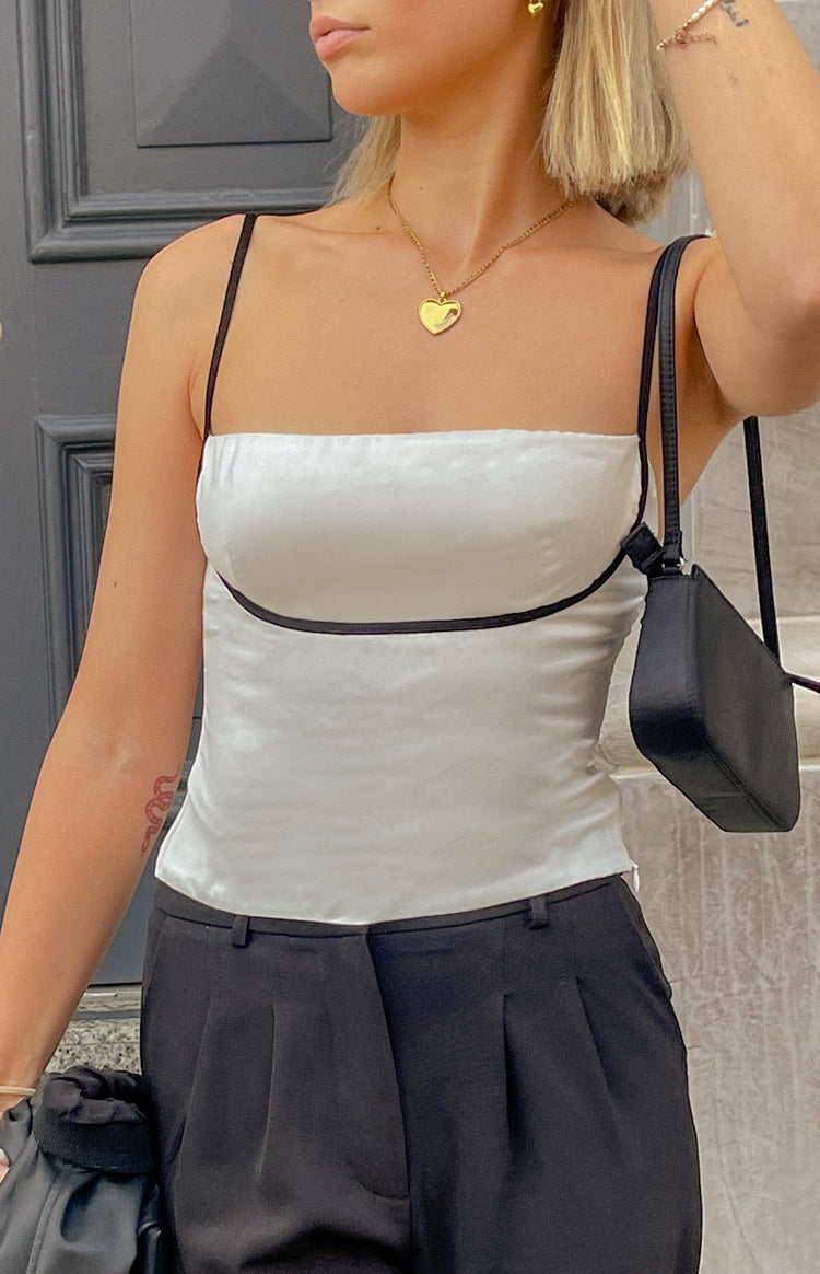 Beginning Boutique Tamra White Low Back Top white satin fitted top with black trim and thin spaghetti straps