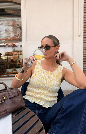 Beginning Boutique Tango Yellow Top yellow and white gingham check shirred square neck sleeveless top with ruffled hem