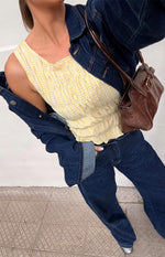 Yellow and white gingham top with a square neckline, shirred bodice, and ruffled hem