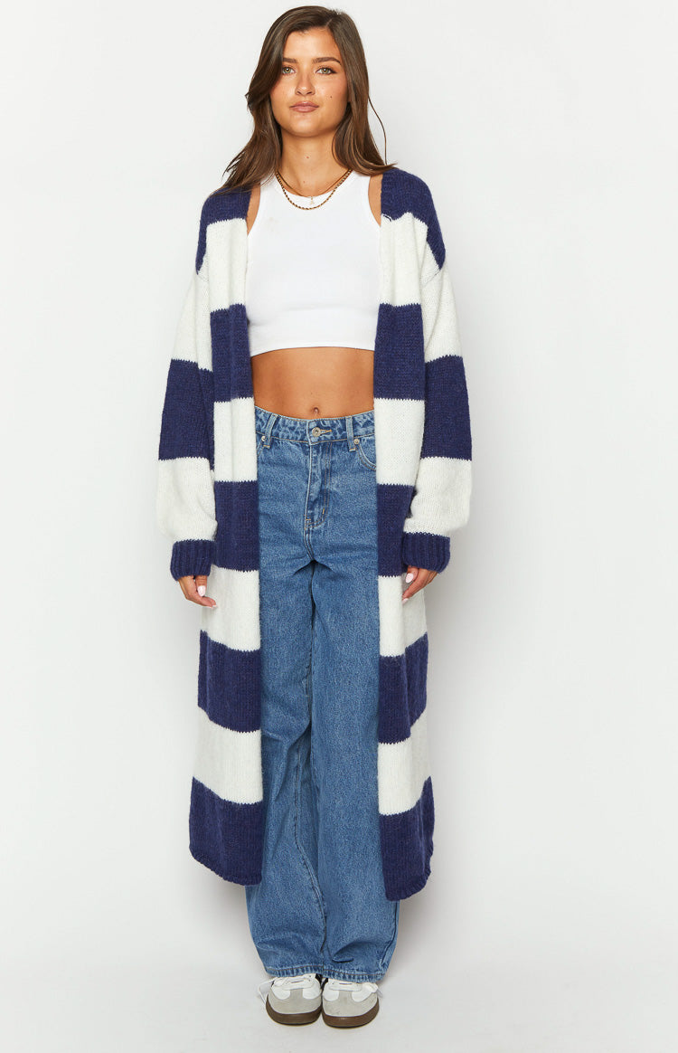 Full length view of a blue and white striped knit cardigan with wide horizontal stripes and an open front