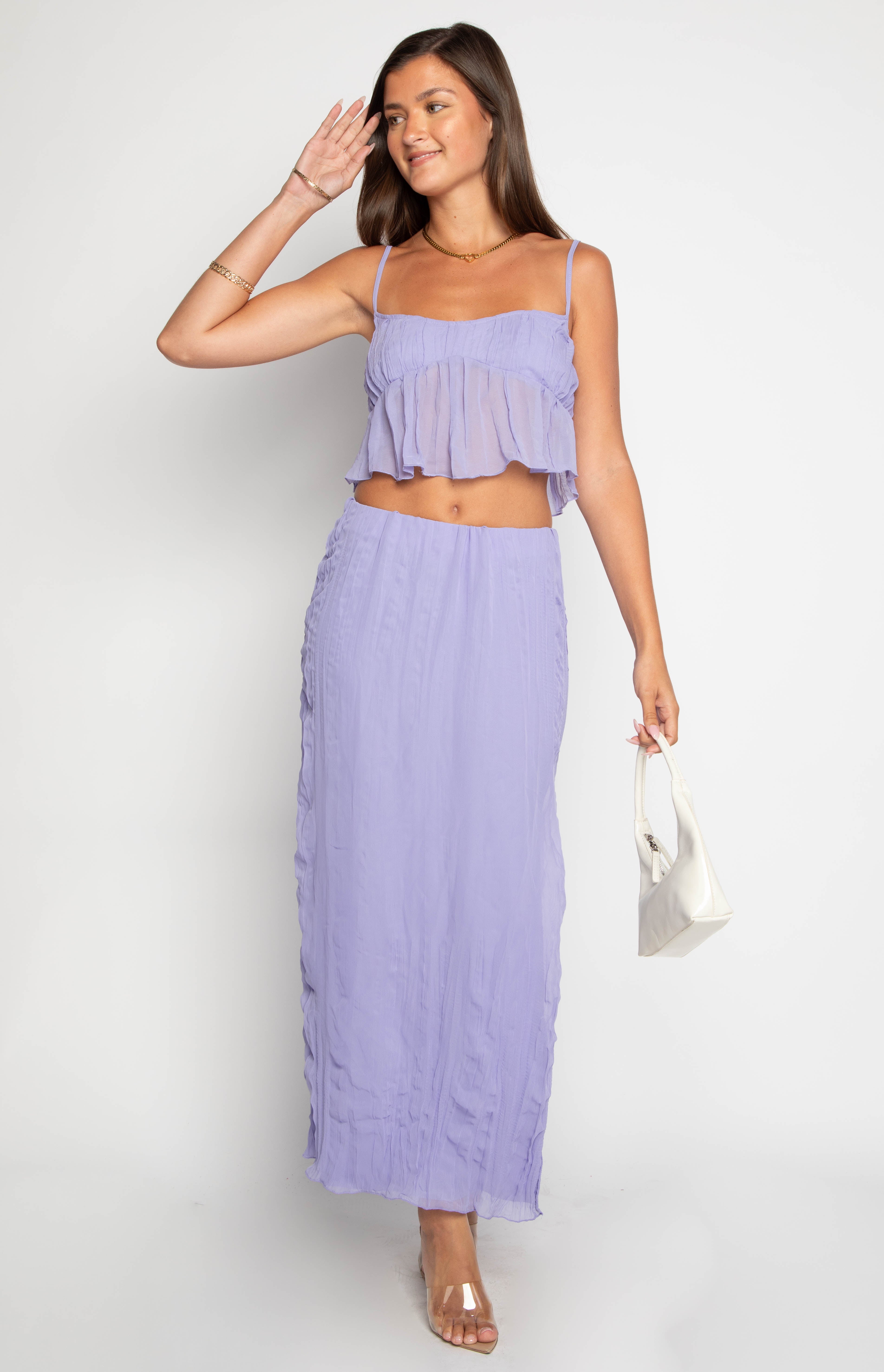 Purple cropped cami top with thin spaghetti straps, a square neckline, and a sheer ruffled overlay