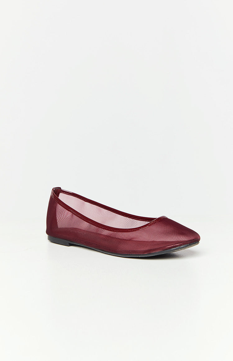 Side view of a cherry sheer mesh ballet flat with a pointed toe and patent trim