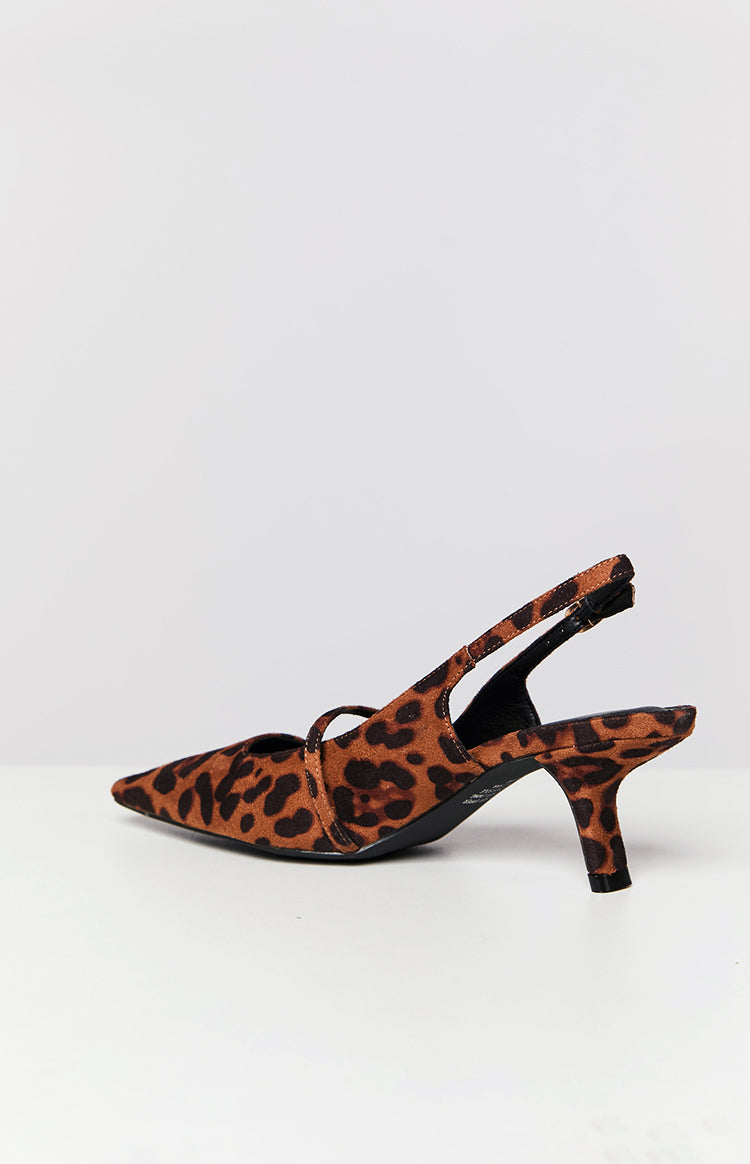 Side view of a leopard print slingback heel with a pointed toe, cross-over strap, and kitten heel
