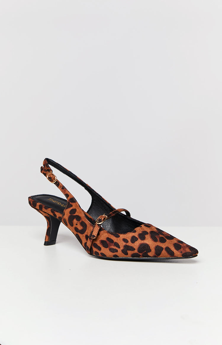 Side view of a leopard print kitten heel with a pointed toe, slingback strap, and Mary Jane style strap