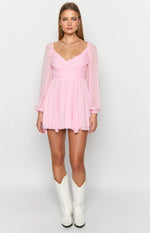 Pink long sleeve mini dress with a ruched sweetheart neckline, wrap-style bodice, and flowy skirt