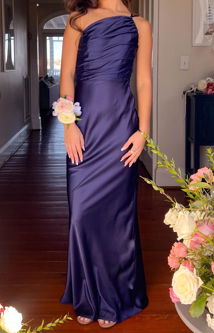 Navy satin one-shoulder maxi dress with a ruched bodice and flowing skirt