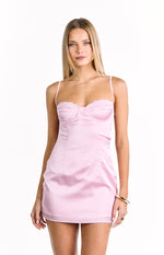 Front view of a light pink satin mini dress with a structured bustier bodice and delicate lace trim