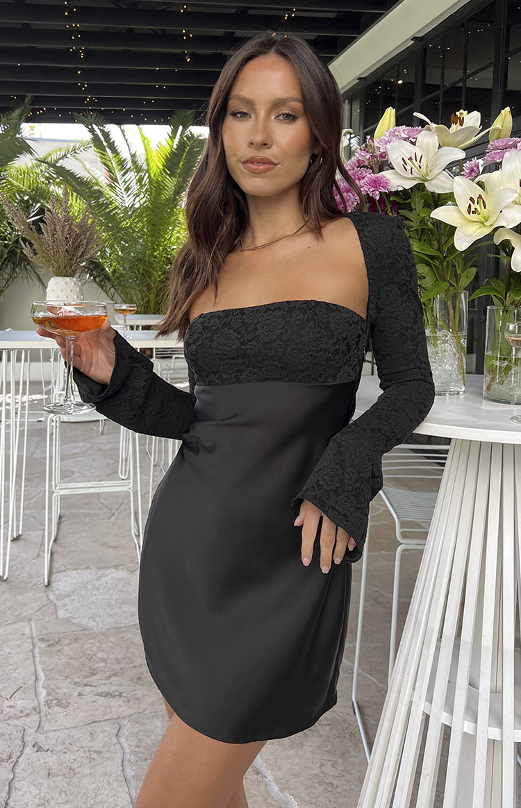 Black mini dress with a square neckline, long lace sleeves, and a smooth satin mini skirt