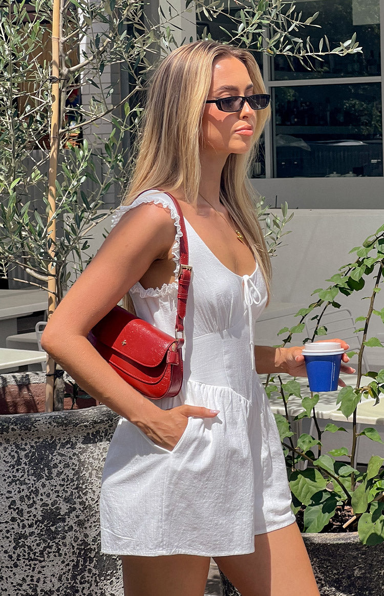Beginning Boutique Vanilla Veil White Frill Playsuit white textured scoop neck playsuit with frill straps and tie front