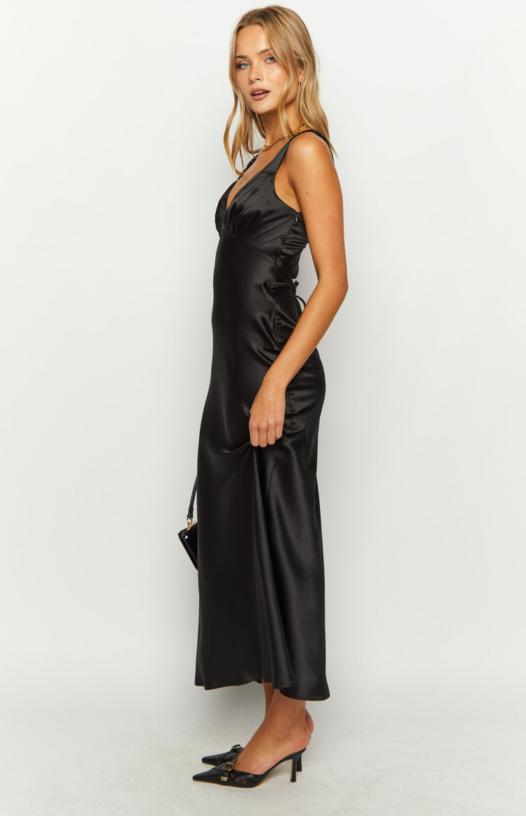 Side view of a black satin maxi dress with a V-neckline, gathered bust, and side lace-up detail