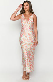 Full length front view of a light floral paisley maxi dress with a V-neckline and fitted ruched bodice
