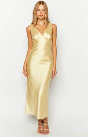 Front view of a yellow satin maxi dress with a deep V-neck and gathered bust detail