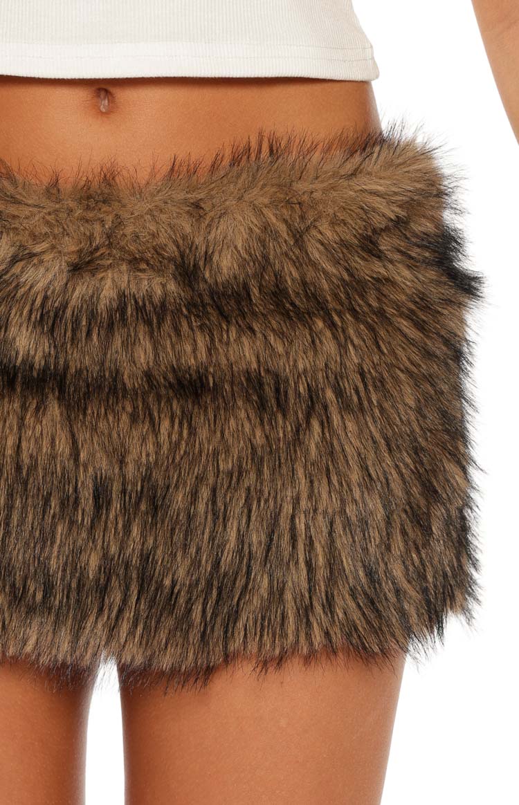 Close-up of the brown fur mini skirt showing the shaggy texture and waistband