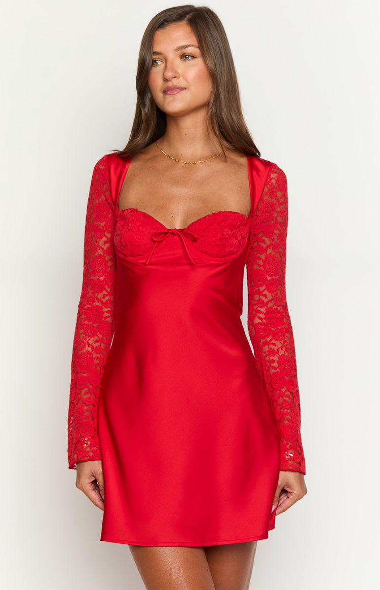 Red mini dress with sweetheart neckline, lace bust overlay, small bow detail, and sheer lace long sleeves